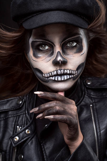 istock Woman with halloween skull makeup 1278679811