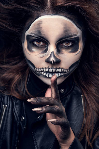 istock Woman with halloween skull makeup 1278679915