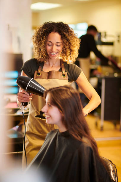 istock hair stylist with customer 1278681082