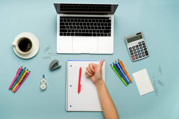 istock the person writing in a notebook and study online with the laptop. 1278681127