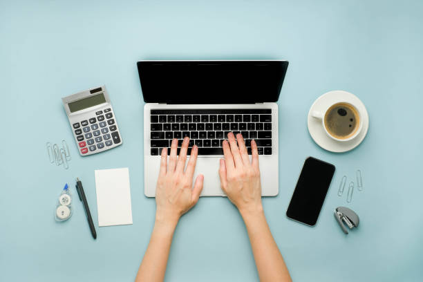 istock the person analyzing financial data.office and study stationery with a laptop for online work and back to school. 1278681716