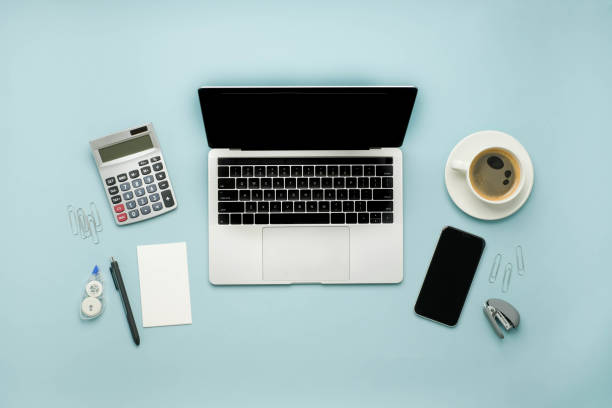 istock office supplies on a blue background. study online and work with the laptop concept. 1278681759