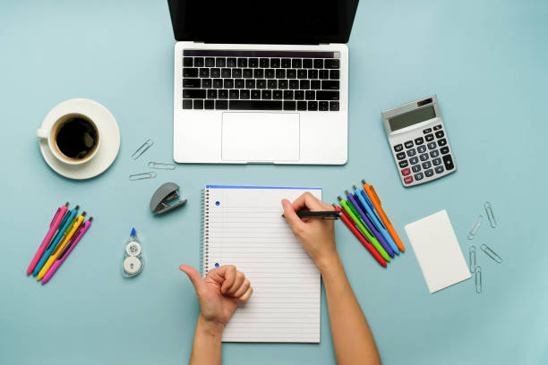 istock the person writing in a notebook and study online with the laptop. 1278682008