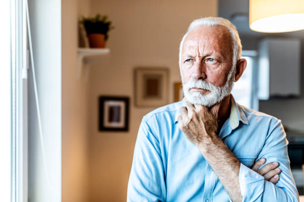 istock Depressed senior man at home 1278684959