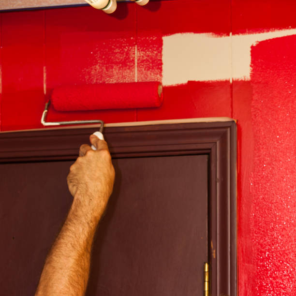 istock Painting House Wall with Roller Brush 1278686745