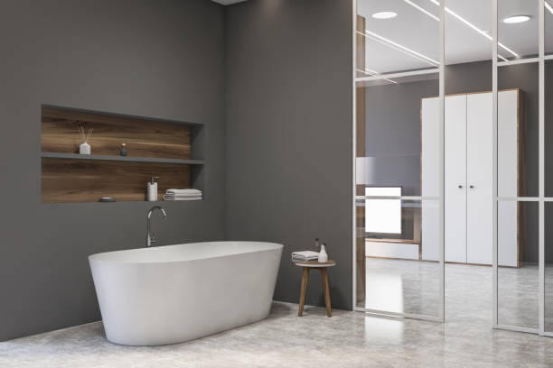 istock Grey bathroom corner with tub and shelf 1278692210