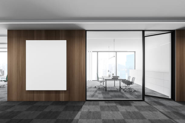 istock White and wooden open space office with poster 1278692311