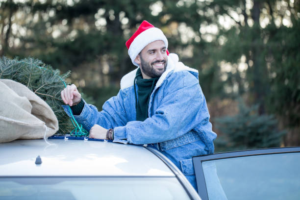 istock Man shopping for Christmass tree 1278692453