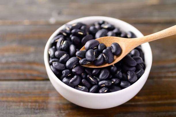 istock Black kidney beans in a bowl with spoon 1278693319