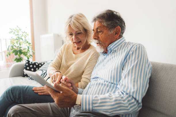 istock Keeping up with modern times - Senior couple using online bank account 1278694836