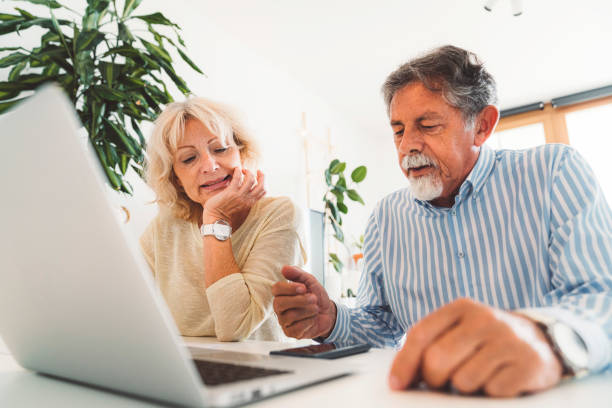 istock Caucasian senior couple making a financial plan on the laptop 1278694844