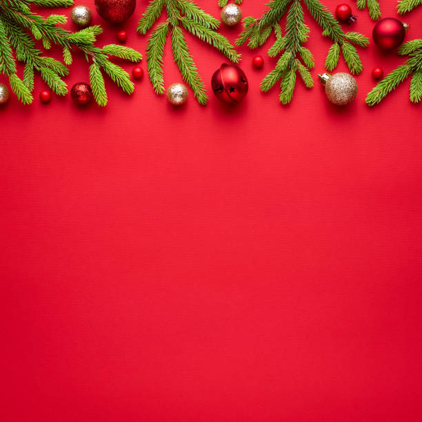 istock Square christmas card with fir decorations on red background 1278695661