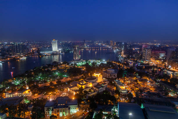 Night in cairo Night aerial view of Cairo and Nile river in Egypt. egypt skyline stock pictures, royalty-free photos & images