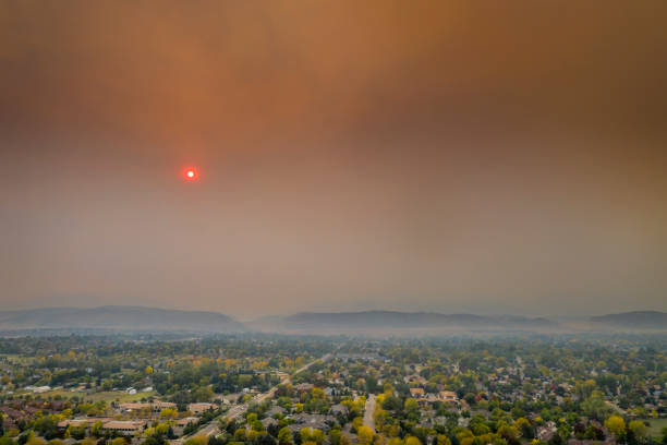 wildfire smoke over Fort Collins, Colorado smoke from Cameron Peak (CO) and Mullen (WY) Fires (October 2020) over Fort Collins and Front Range of Rocky Mountains in northern Colorado,  afternoon aerial view wildfire smoke stock pictures, royalty-free photos & images