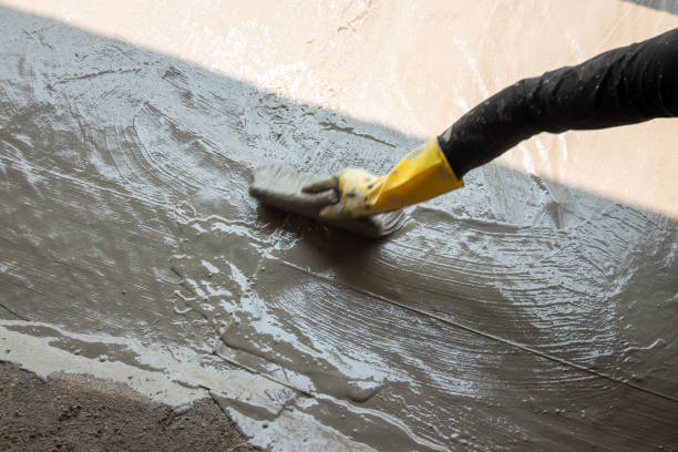 istock worker making textile with cement mixed with waterproof material on the floor 1278699659