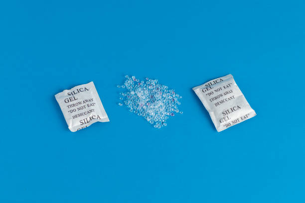 istock Desiccant or silica gel indifferent packaging and spread on blue background. 1278700820