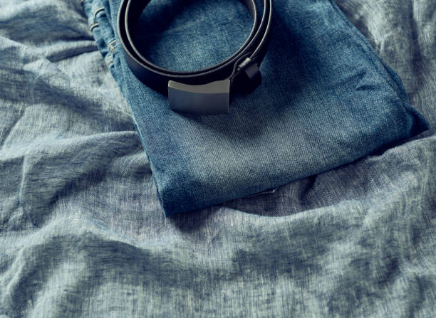 istock Jeans trousers on blue background. Copy space. 1278702349