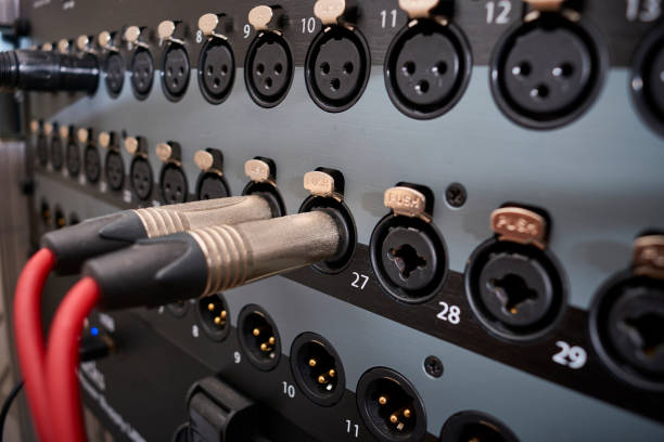 istock instrument audio jack connectors inserted into channels on a mixing desk in a recording studio 1278704230
