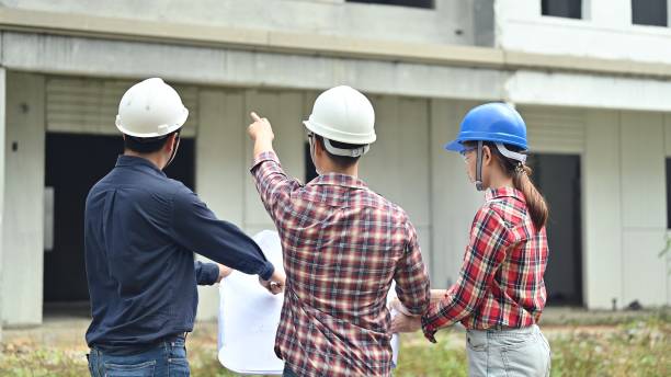 istock Engineer team discuss and working at construction property site. Owner inspection at village project and estate building. 1278704963