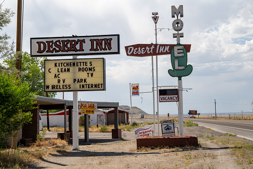 Shoshoni, Wyoming - July 25, 2020: Desert Inn with its vintage neon sign sits in the desert of Central Wyoming on a summer day