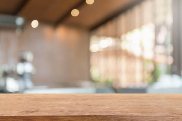istock Empty wood table top and blurred coffee shop, cafe and restaurant interior background - can used for display or montage your products. 1278708493