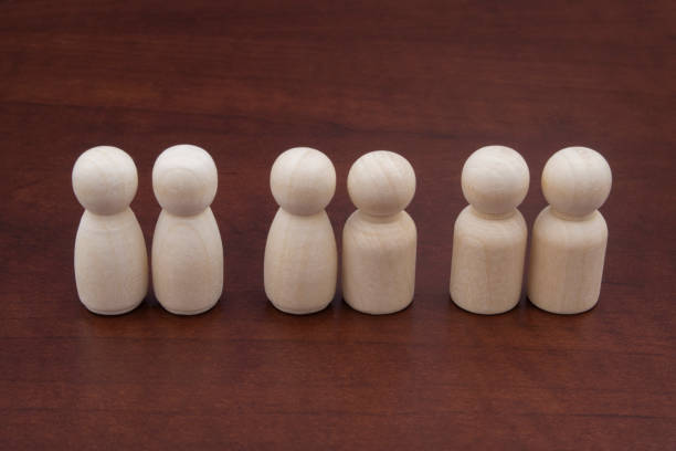 istock Different homosexual and heterosexual couples. Wooden figures on table. 1278714238