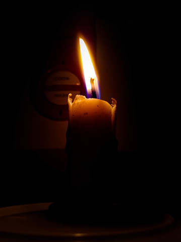candle that is lit when the power goes out for emergency lighting