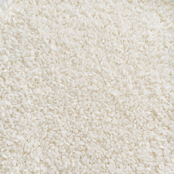 istock white rice texture close up - food background 1278722685