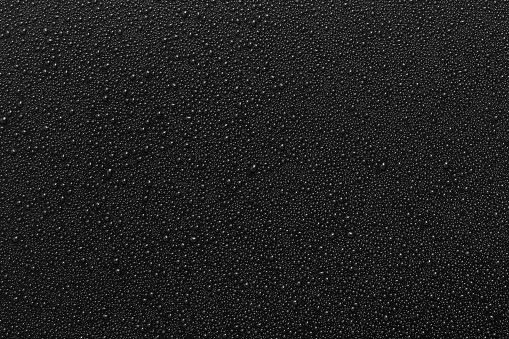 Water droplets on black background