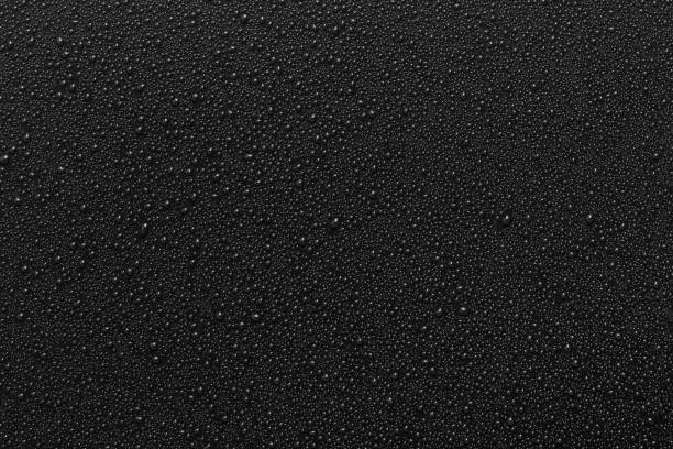 Water droplets on black background stock photo