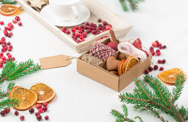 istock Zero waste Christmas concept. Hand crafted christmas gift wrapping without plastic, cranberries, pine cones and branches. 1278724277