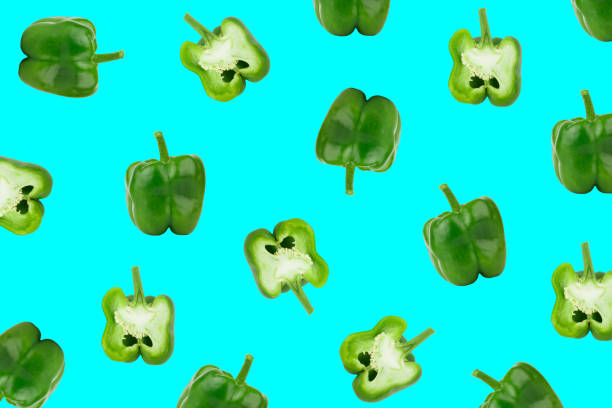 Green bell peppers on the saturated blue background