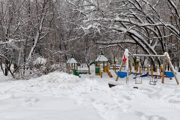 istock Winter snow-covered playground in town after snowfall 1278725224