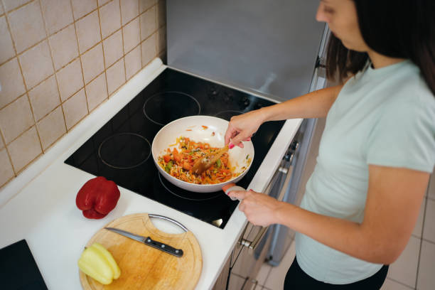 istock Woman preparing a meal 1278726328