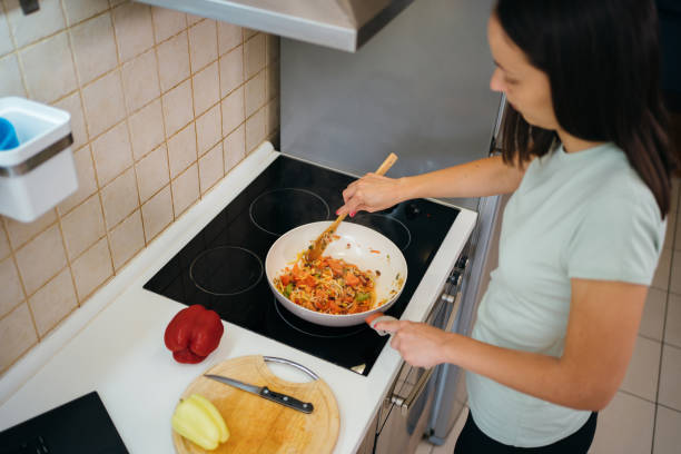 istock Woman preparing a meal 1278726352