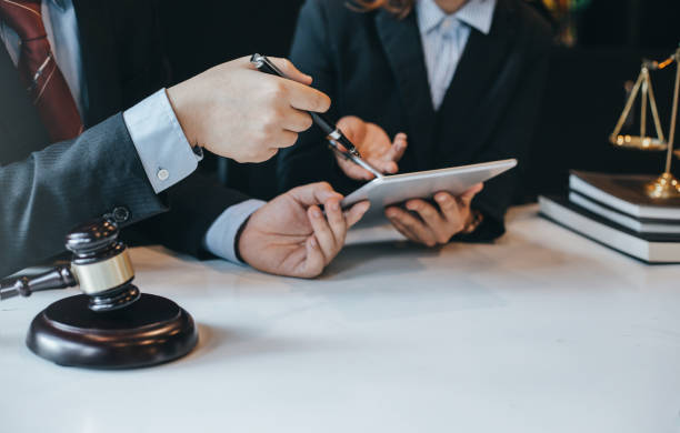 At the meeting, a team of lawyers discussed the lawsuit. Concept of law and justice. At the meeting, a team of lawyers discussed the lawsuit. Concept of law and justice. judge law photos stock pictures, royalty-free photos & images
