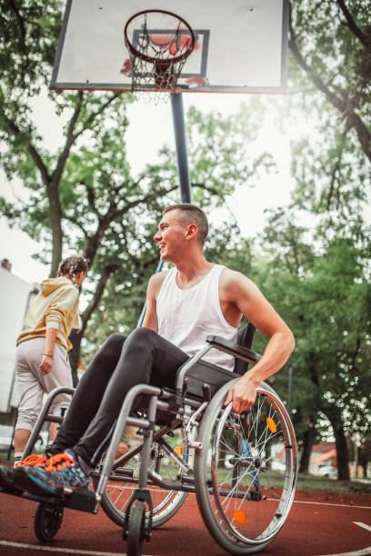 istock Disabled men playing basketball with friends 1278730791
