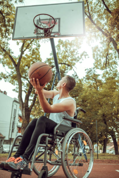 istock Disabled men playing basketball with friends 1278730863