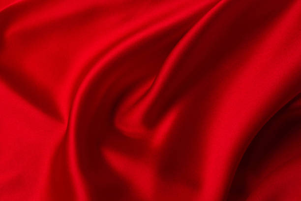 istock Red silk or satin luxury fabric texture can use as abstract background. 1278733555