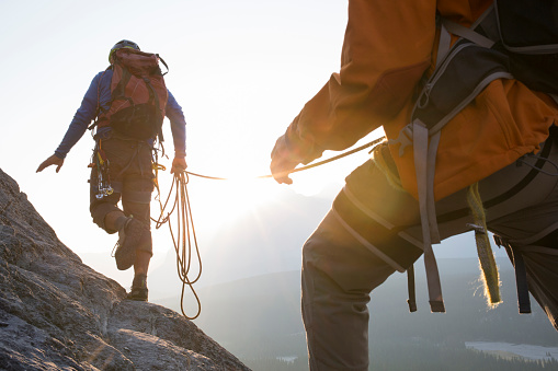 Industrial mountaineering worker in uniform with walkie-talkie