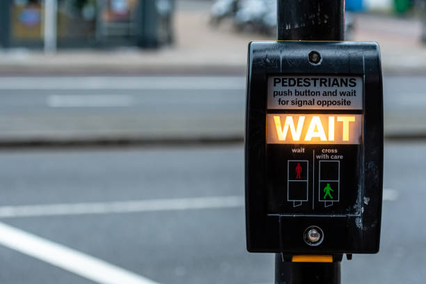istock Crosswalk button for pedestrian with light warning on a defocused background , London, UK 1278737451