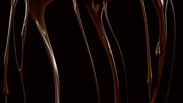 Splashing melted chocolate on black background