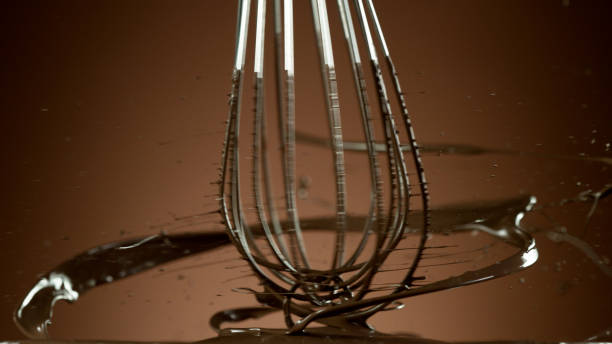 Freeze motion of wire whisk rotating hot melted chocolate