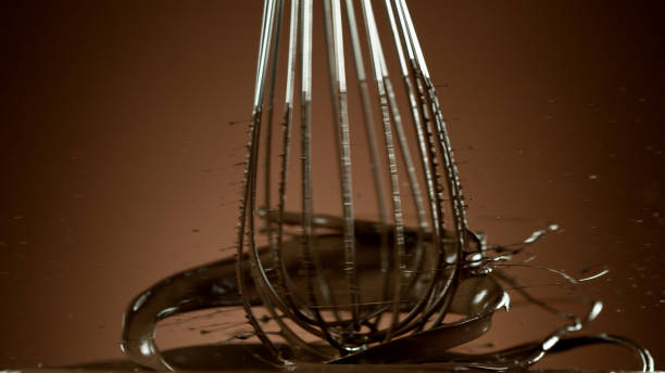 Freeze motion of wire whisk rotating hot melted chocolate