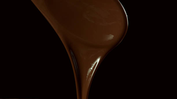 istock Wooden spoon stirring soft melted rich chocolate 1278739340