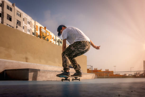 istock photo 4 (jump). Young skater does a trick called boneless. skateboarding 1278739733