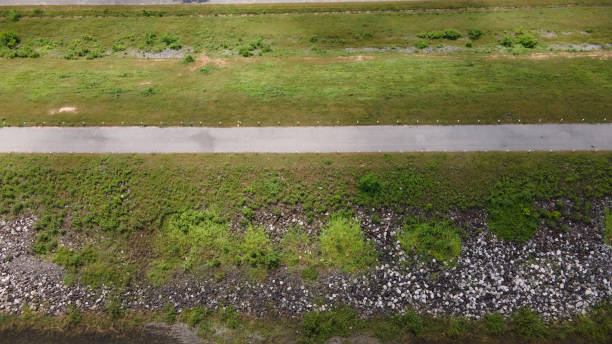 istock Aerial view asphalt road through dam nature landscape 1278744190