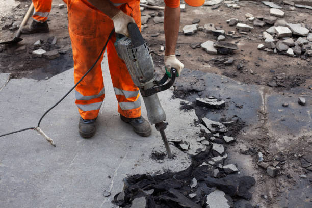 istock Working with a jackhammer. Removal of asphalt. Change of road surface. 1278744404