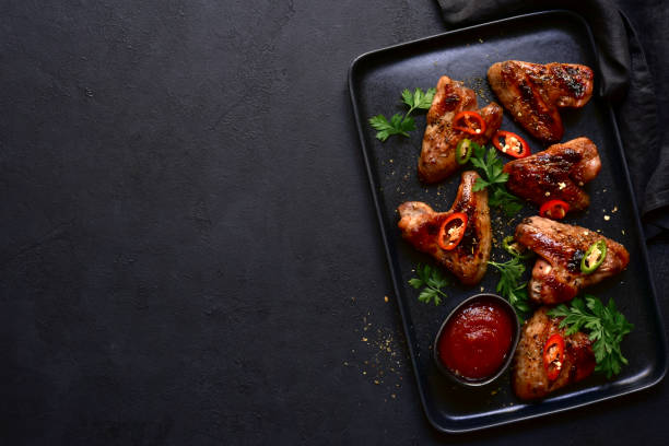istock Grilled spicy chicken wings with ketchup 1278747123