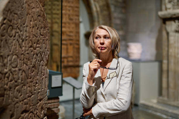 istock Woman exploring medieval expositions in museum 1278747141